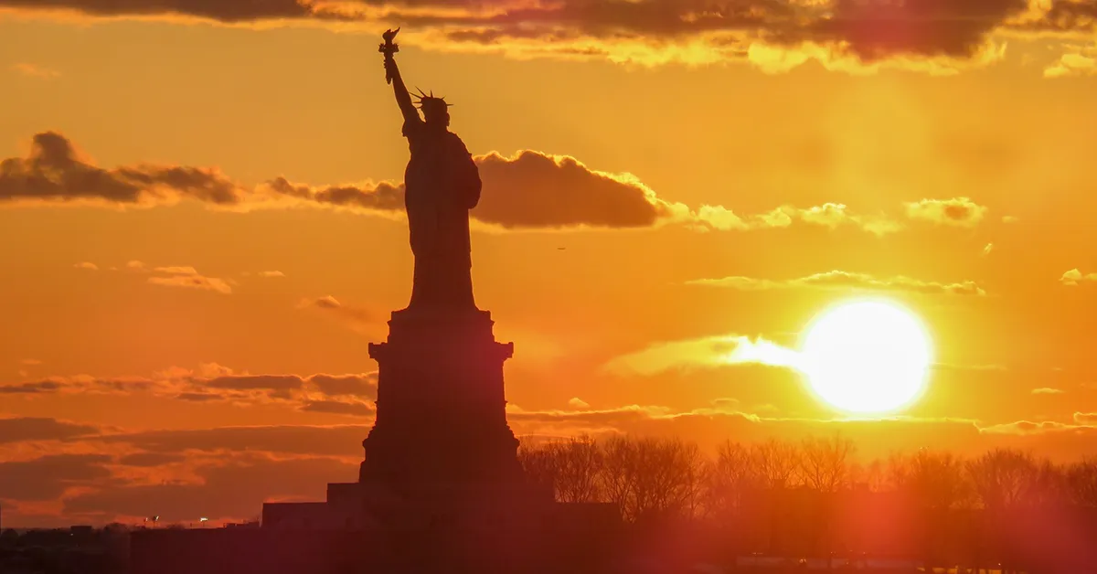 statue of liberty at sunset