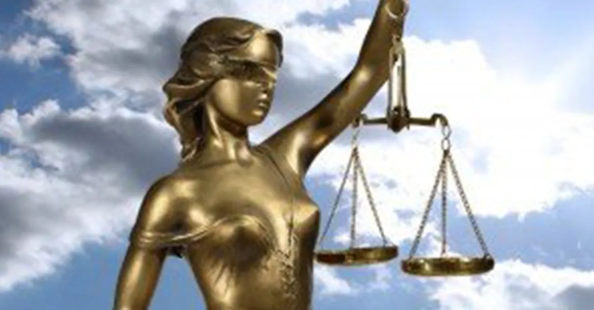 Statue of Lady Justice holding a scale